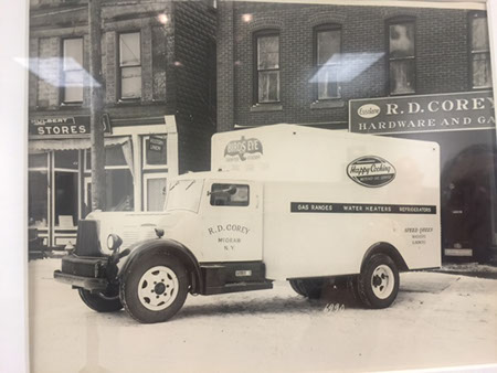 Image of a truck in front of a hardware store.