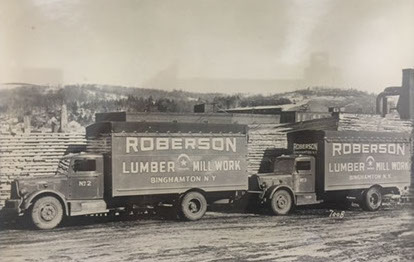 Image of 2 lumber trucks.