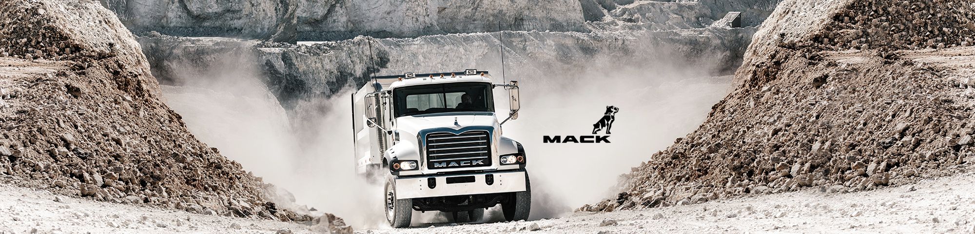 Image of a Mack truck on rough terrain.